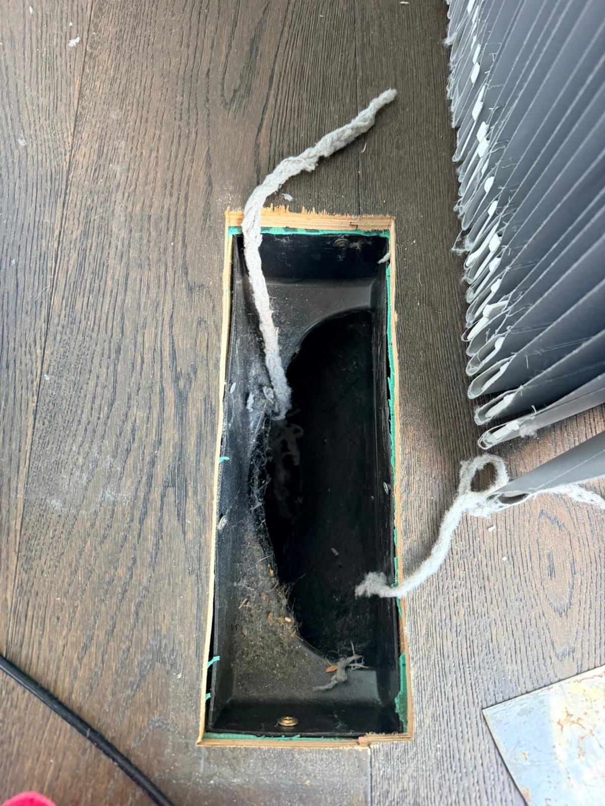 Under-floor air vent · lint & dust removed